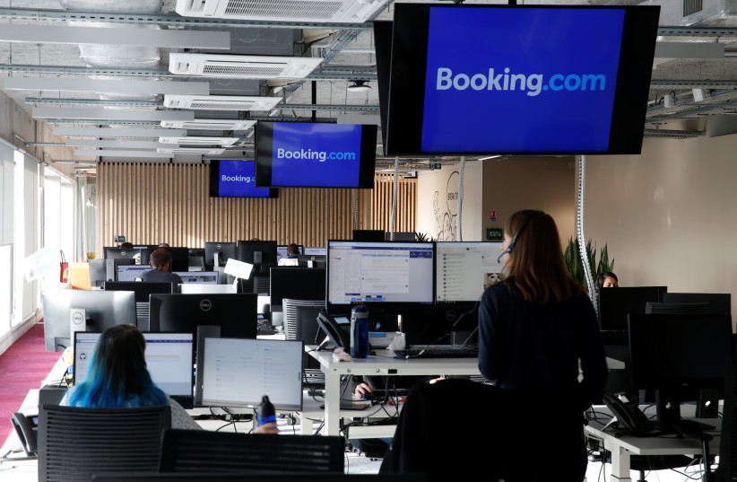  Employees work on computers at the new Booking.com customers site in Tourcoing (photo credit: REUTERS)