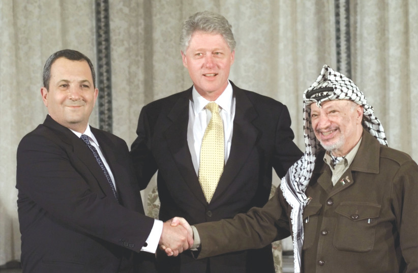  A 1999 PHOTO opportunity with Ehud Barak, Bill Clinton and Yasser Arafat: Palestinian rejectionism won the day whenever a concrete partition was on the agenda, such as the one offered by Barak in 2000, says the writer. (photo credit: WIN MCNAMEE/REUTERS)