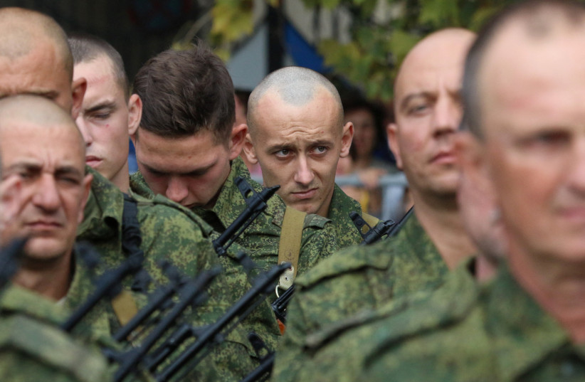  Reservists drafted during the partial mobilisation attend a ceremony before departure for military bases, in Sevastopol, Crimea September 27, 2022. (credit: REUTERS/ALEXEY PAVLISHAK)