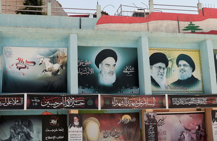  CURTAILING IRAN’S smuggling of advanced weaponry to Hezbollah: Banners depict (from L) Iran’s late leader Ayatollah Ruhollah Khomeini, Iran’s Supreme Leader Ayatollah Ali Khamenei and Hezbollah leader Sayyed Hassan Nasrallah, in Yaroun, southern Lebanon, August 15. (photo credit: REUTERS/ISSAM ABDALLAH)
