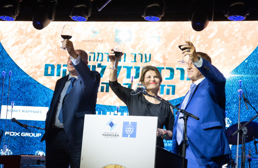  RAISING A toast (from R): Moshe Levy, chairman, Hadassah International Israel; Dalia Itzik, chairwoman, board of directors, Hadassah Medical Organization; and Yoram Weiss, director-general, Hadassah Medical Organization.  (photo credit: AVI HAYUN)