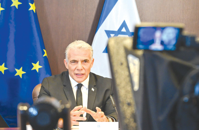 Prime Minister Yair Lapid speaks in a video call from Israel with representatives of the European Union, on Monday. (photo credit: KOBI GIDEON/GPO)