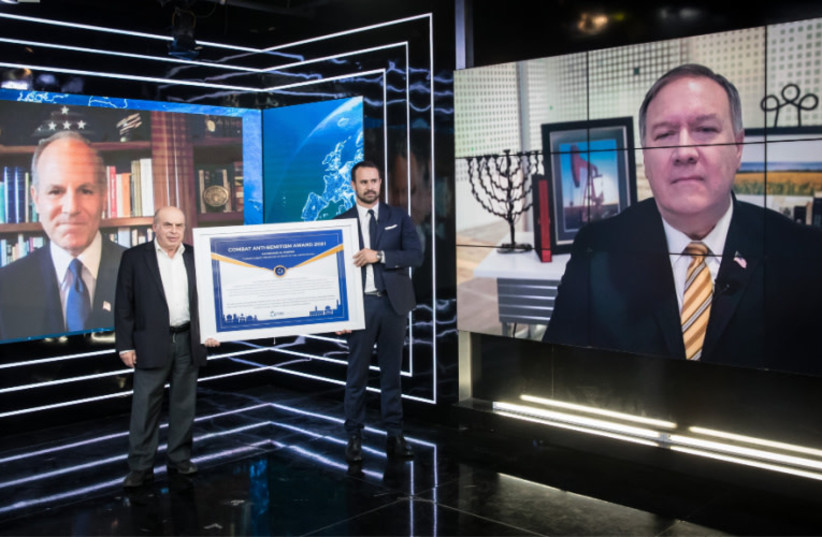  Sharansky and CEO Roytman Dratwa presenting an award to former US secretary of state Mike Pompeo for combating Antisemitism. (photo credit: ODED KARNI)