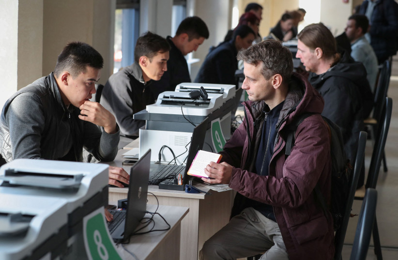  Russian citizens visit a public service center to receive an individual identification number for foreigners in the city of Almaty, Kazakhstan, October 3, 2022 (credit: REUTERS/PAVEL MIKHEYEV)