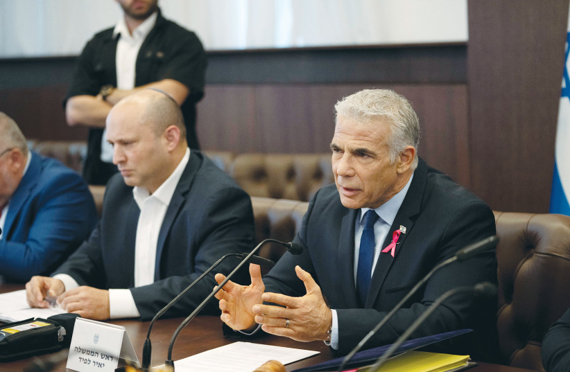  PRIME MINISTER Yair Lapid sits alongside Alternate Prime Minister Naftali Bennett at last Sunday’s cabinet meeting in Jerusalem. After Lapid’s speech to the UN, Bennett was quick to declare that there is no point in reviving the idea of a Palestinian state (photo credit: MAYA ALLERUZZO/REUTERS)