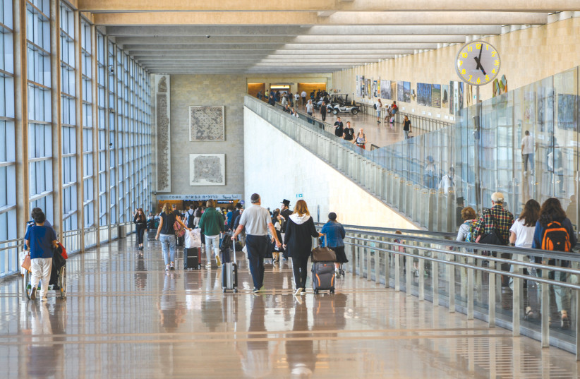  TRAVELERS COME and go at Ben-Gurion Airport last month (photo credit: Arie Leib Abrams/Flash90)