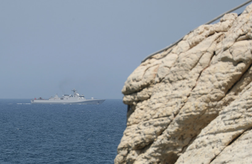  AN ISRAELI Navy boat is seen in the Mediterranean Sea from Rosh Hanikra, close to the Lebanese border (photo credit: AMMAR AWAD/REUTERS)