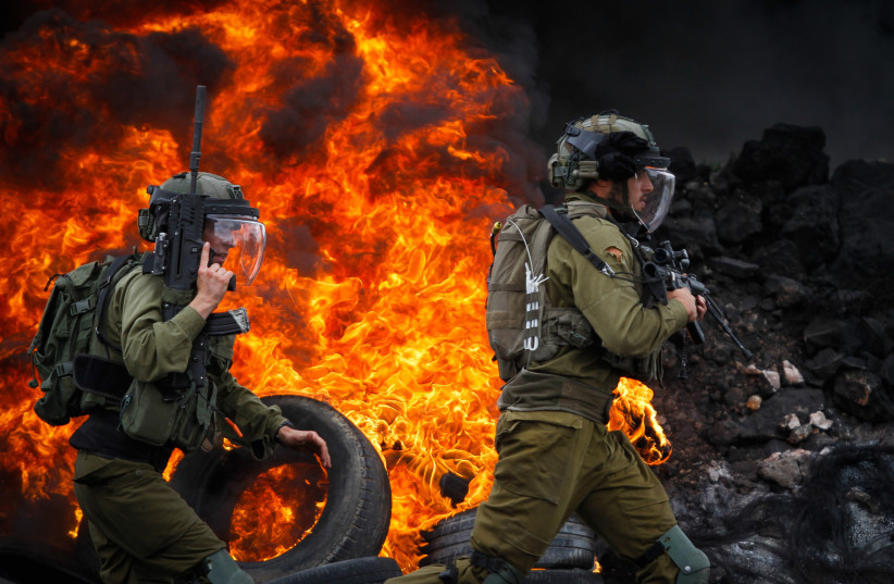 Palestinian demonstrators clash with IDF and Israeli security forces during a protest in the village of Kfar Qaddum, near the West Bank city of Nablus, October 7, 2022. (photo credit: NASSER ISHTAYEH/FLASH90)