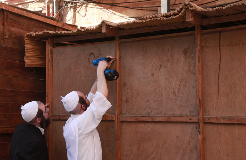  Building a sukkah in Mea She'arim (photo credit: MARC ISRAEL SELLEM)