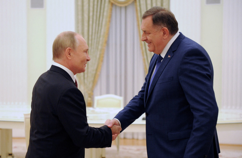 Russian President Vladimir Putin shakes hands with Serb member of the tripartite Bosnian Presidency Milorad Dodik during a meeting in Moscow, Russia, September 20, 2022. (photo credit: SPUTNIK/MIKHAIL KLIMENTYEV/KREMLIN VIA REUTERS)