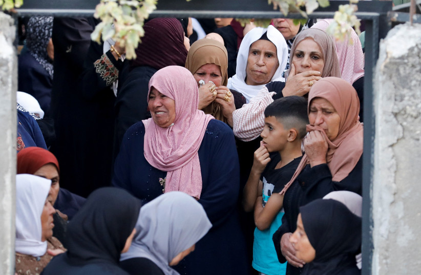 Mourners attend the funeral of Mahmoud Samoudi, 12, who died of a wound he sustained during an Israeli raid in Jenin, West Bank, October 10, 2022. (photo credit: REUTERS/RANEEN SAWAFTA)