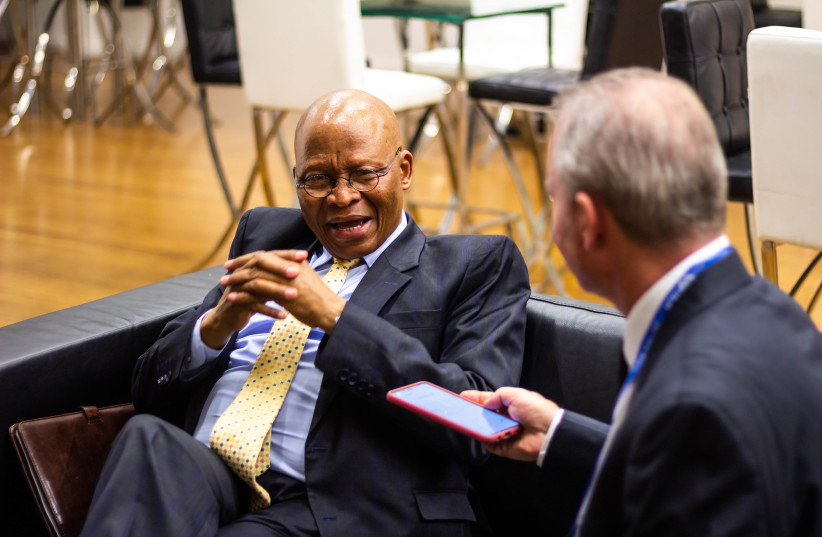 Former South African Chief Justice Mogoeng Mogoeng talks to Steve Linde at the Payis Arena on Tuesday.  (credit: LIAT FORBERG)