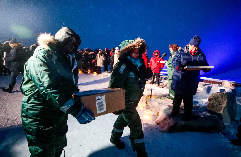  Representatives from many countries and universities arrive in the Svalbard's global seed vault with new seeds, in Longyearbyen (photo credit: REUTERS)