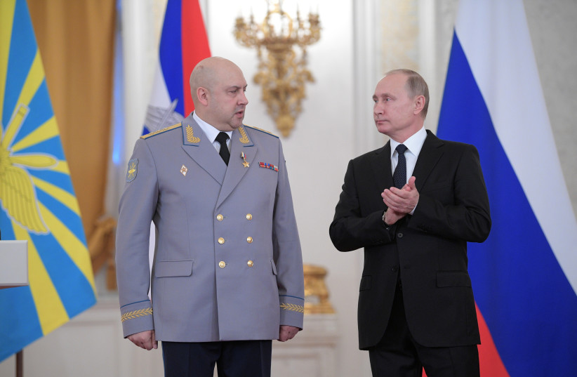  Russian President Vladimir Putin and Colonel General Sergei Surovikin, commander of Russian forces in Syria, attend a state awards ceremony for military personnel who served in Syria, at the Kremlin (credit: REUTERS)