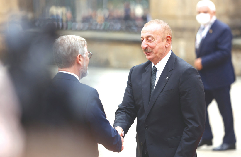  AZERBAIJANI PRESIDENT Ilham Aliyev (right) is welcomed by Czech Prime Minister Petr Fiala at an EU summit in Prague last week. (photo credit: Eva Korinkova/Reuters)