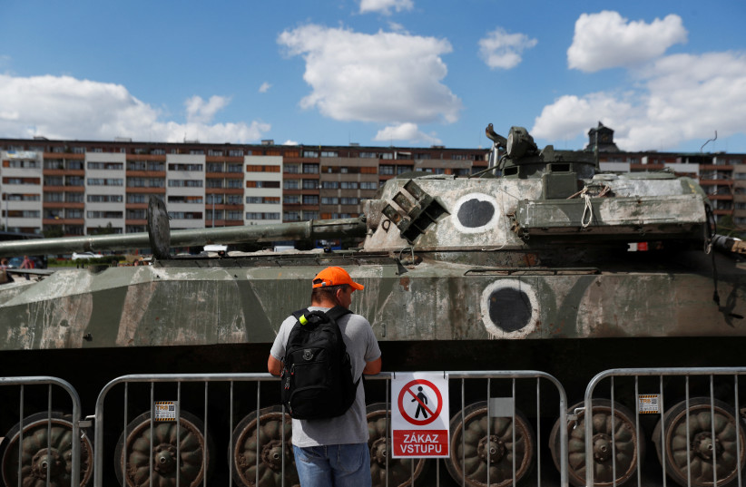  A man looks at Russian military equipment destroyed by the Armed Forces of Ukraine displayed, as Russia's attack on Ukraine continues, in Prague, Czech Republic, July 11, 2022. (credit: REUTERS/DAVID W CERNY)