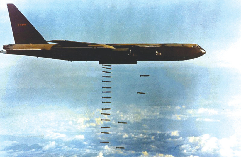  A US Air Force Boeing B-52 drops bombs during the Vietnam War.  (photo credit: Wikimedia Commons)