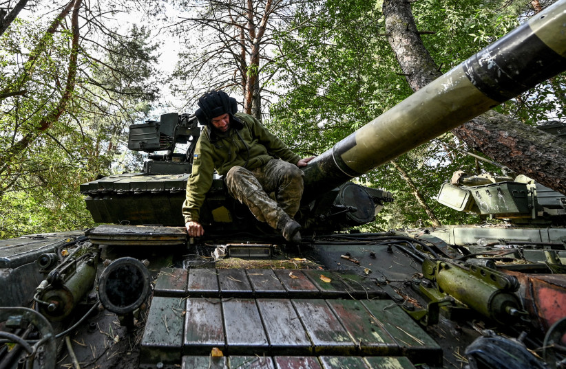 Ukrainian serviceman is seen atop of a tank at a position near a frontline, amid Russia's attack on Ukraine, in Donetsk region, Ukraine, September 16, 2022. (credit: REUTERS/STRINGER)