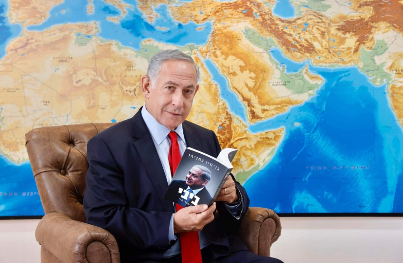  Former prime minister Benjamin Netanyahu with his new book, "Bibi: My Story" (photo credit: MARC ISRAEL SELLEM/THE JERUSALEM POST)