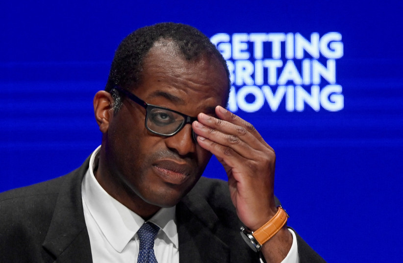  British Chancellor of the Exchequer Kwasi Kwarteng adjusts his glasses during Britain's Conservative Party's annual conference in Birmingham, Britain (photo credit: REUTERS)