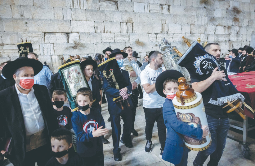  Celebrations take place at the Western Wall after the conclusion of Simhat Torah, last year. (photo credit: YONATAN SINDEL/FLASH90)