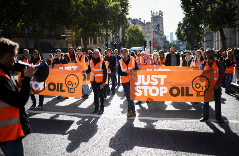  Demonstrators participate in a ''Just Stop Oil'' protest outside Downing Street in London, Britain, October 9, 2022.  (credit: REUTERS/HENRY NICHOLLS)