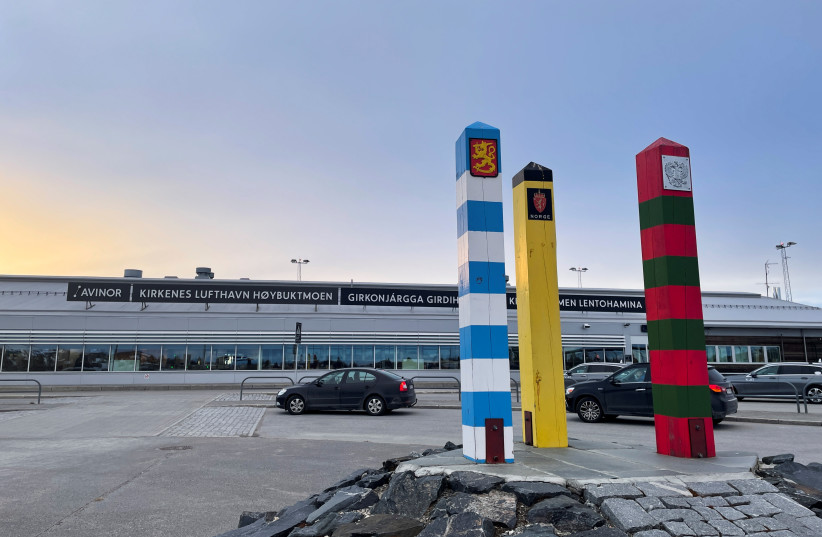  The border posts of Finland (blue and white), Norway (black and yellow) and Russia (red and green), stand outside the airport of the Norwegian Arctic town of Kirkenes, Norway, May 8, 2022. (credit: REUTERS/GWLADYS FOUCHE)