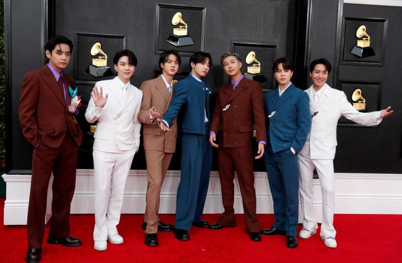 BTS pose on the red carpet as they attend the 64th Annual Grammy Awards at the MGM Grand Garden Arena in Las Vegas, Nevada, US, April 3, 2022. (photo credit: REUTERS/Maria Alejandra Cardona/File Photo)