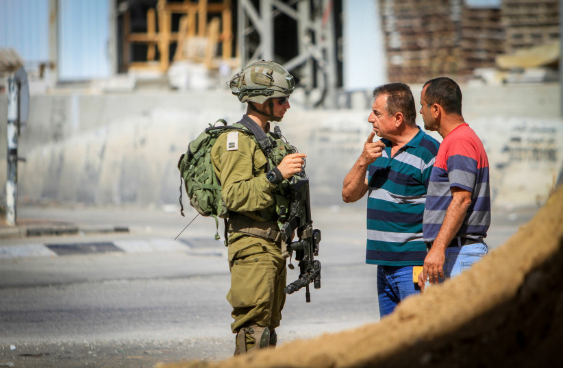  Israeli soldiers block the entrance and exit for cars in the West Bank city of Nablus, on October 17, 2022, during an army operation.  (credit: NASSER ISHTAYEH/FLASH90)