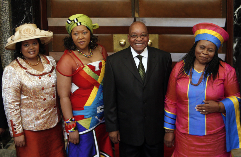 South African President Jacob Zuma poses for photographs with his three wives Sizakele Khumalo (R), Nompumelelo Ntuli (L) and Thobeka Mabhija after delivering his state-of-the-nation address in parliament in Cape Town June 3, 2009.  (credit: MIKE HUTCHINGS / REUTERS)