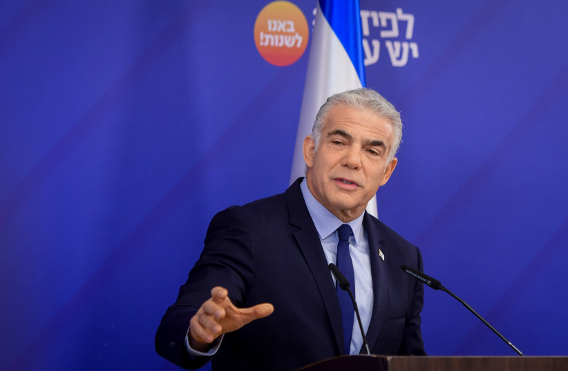  Prime Minister and Head of the Yesh Atid party Yair Lapid speaks during a faction meeting in Tel Aviv on October 18, 2022. (photo credit: AVSHALOM SASSONI/FLASH90)