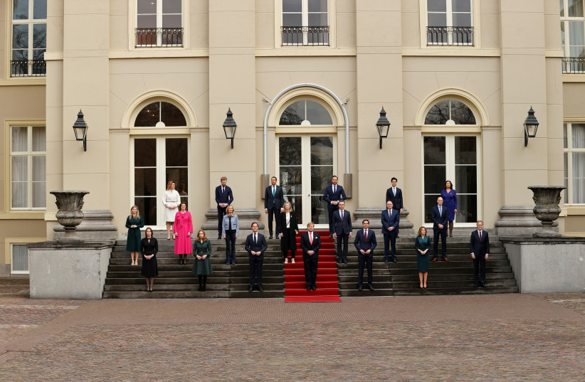  King Willem-Alexander of the Netherlands poses with Prime Minister Mark Rutte and the new members of the Dutch Government at the Noordeinde Palace in The Hague, the Netherlands, January 10, 2022. (photo credit: SEM VAN DER WAL/Pool via REUTERS)