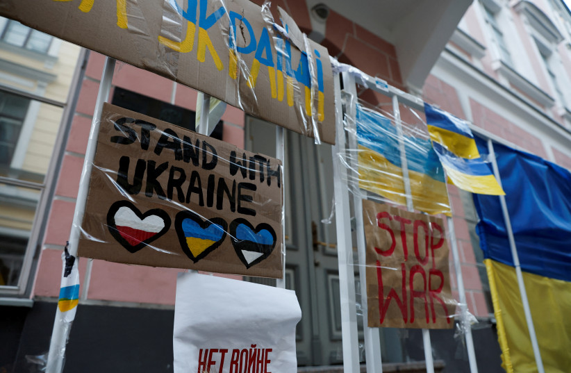  The Ukrainian Embassy's railing is seen decorated with placards, Ukrainian flags and messages in support of the Ukrainian people in Tallinn, Estonia March 19, 2022 (photo credit: REUTERS/BENOIT TESSIER)