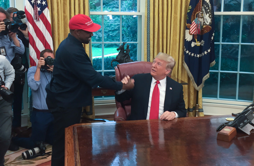  Then-US president Donald Trump meets with rapper Kanye West in the Oval Office of the White House in Washington, DC, October 11, 2018. (credit: SEBASTIAN SMITH/AFP VIA GETTY IMAGES)