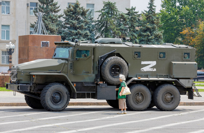  An armoured truck of pro-Russian troops is parked near Ukraine's former regional council's building during Ukraine-Russia conflict in the Russia-controlled city of Kherson, Ukraine July 25, 2022 (credit: Alexander Ermochenko/Reuters)