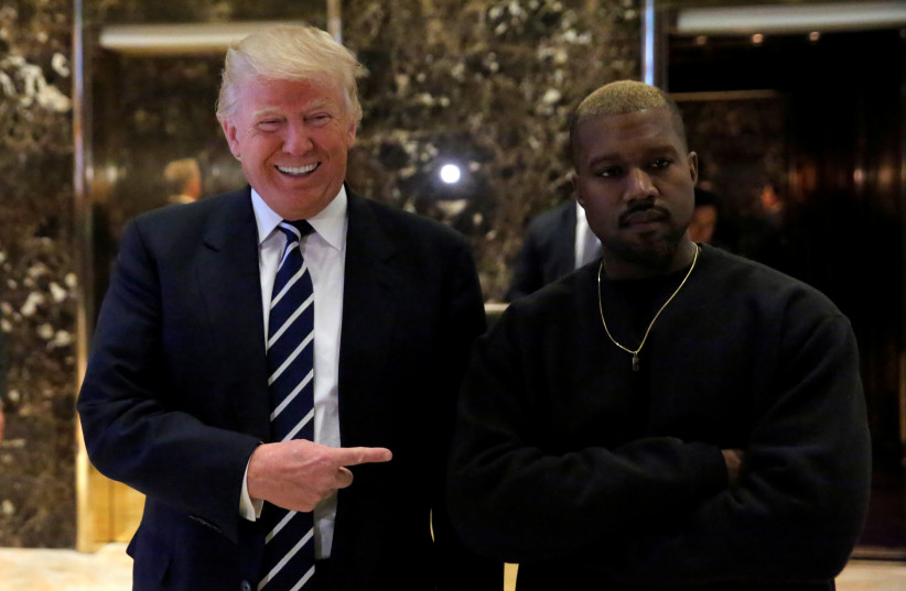  Then US-president elect Donald Trump and musician Kanye West pose for media at Trump Tower in Manhattan, New York City, US, December 13, 2016.  (credit: REUTERS/ANDREW KELLY)