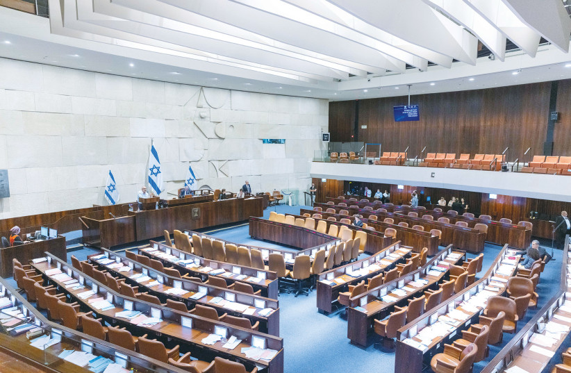  A NEARLY-EMPTY Knesset plenum debates the dispersal of parliament, in June. In the upcoming election, be a strategic and principled voter, not a tactical and cynical one, says the writer.  (photo credit: OLIVIER FITOUSSI/FLASH90)