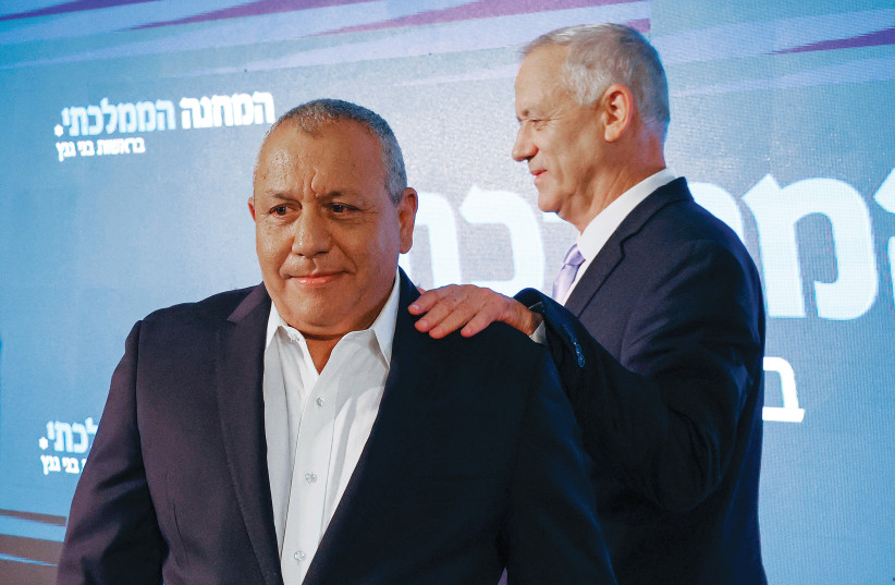  GADI EISENKOT gets a steady hand from his party leader Benny Gantz at a press conference announcing his entry into politics earlier this year.  (photo credit: JACK GUEZ/AFP VIA GETTY IMAGES)