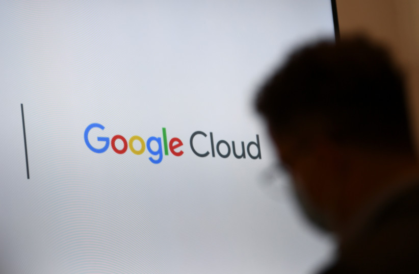 A screen with a Google Cloud logo is pictured during Google's presentation of a detailed investment plan for Germany outside the Google office in Berlin, Germany, August 31, 2021. (credit: REUTERS/ANNEGRET HILSE)