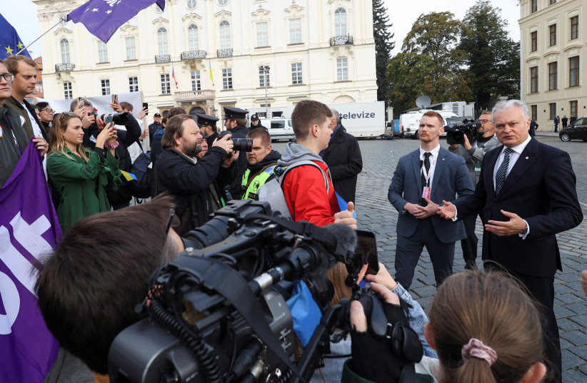 Lithuania's President Gitanas Nauseda speaks with protesters outside Prague Castle, during the Informal EU 27 Summit and Meeting within the European Political Community, in Prague, Czech Republic, October 7, 2022. (credit: REUTERS/EVA KORINKOVA)