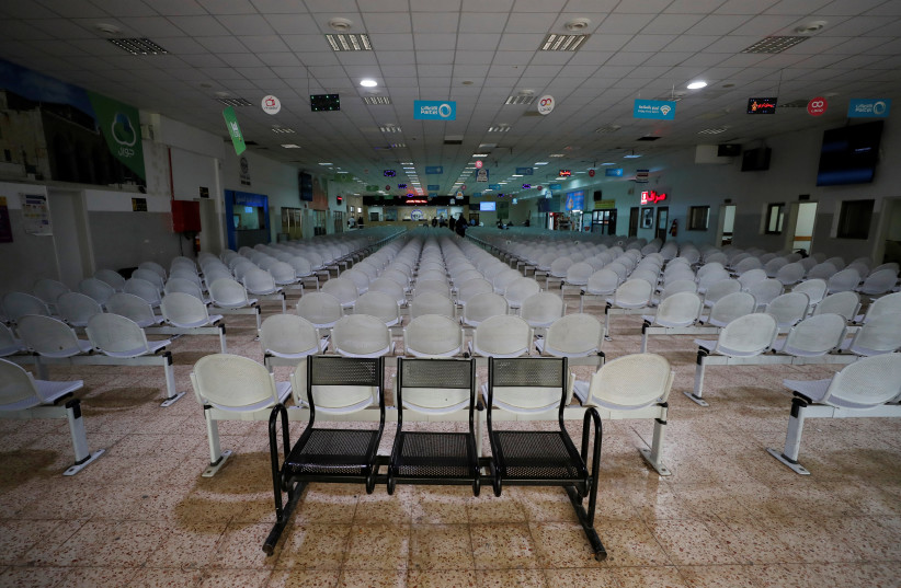  A departure hall is seen almost empty at the Israeli-controlled Allenby Bridge crossing as preventive measures against coronavirus are taken, in Jericho, in the West Bank March 10, 2020.  (credit: REUTERS/AMMAR AWAD)