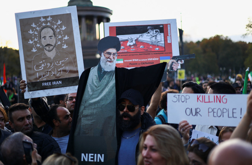 Demonstrators protest following the death of Mahsa Amini in Iran, in Berlin, Germany, October, 22, 2022. (credit: REUTERS/CHRISTIAN MANG)