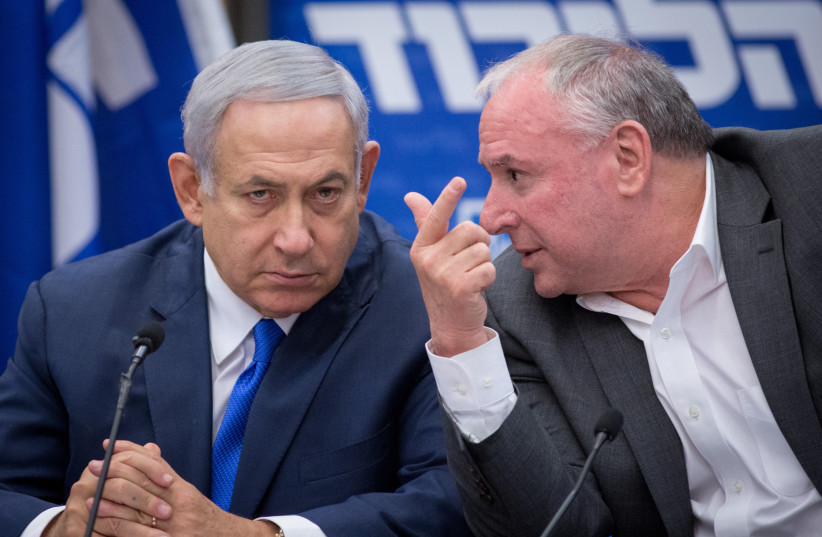  Then-prime minister Benjamin Netanyahu with Likud MK David (Dudi) Amsalem during a faction meeting, November 19, 2018. (credit: MIRIAM ALSTER/FLASH90)