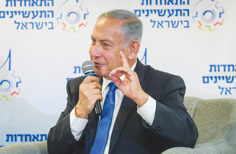  LIKUD CHAIRMAN MK Benjamin Netanyahu speaks last week at a Manufacturers Association conference in Tel Aviv. It’s doubtful his autobiography will have any effect on any of the voters, says the writer. (photo credit: AVSHALOM SASSONI/FLASH90)