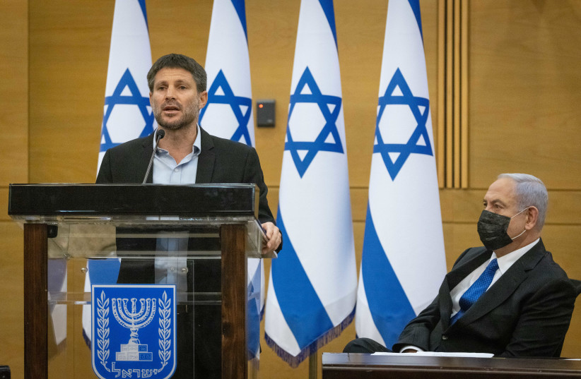  Head of the Religious Zionist Party MK Bezalel Smotrich speaks next to Head of opposition Benjamin Netanyahu during a meeting with the opposition parties at the Knesset, the Israeli parliament, on June 28, 2021.  (photo credit: YONATAN SINDEL/FLASH90)