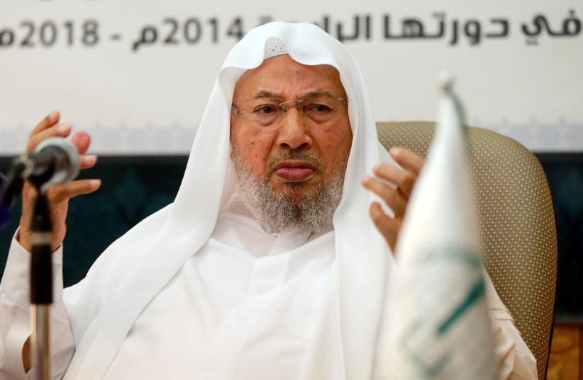  Chairman of the International Union of Muslim Scholars Youssef al-Qaradawi (R) speaks during a news conference in Doha June 23, 2014. (photo credit: Mohammed Dabbous/Reuters)