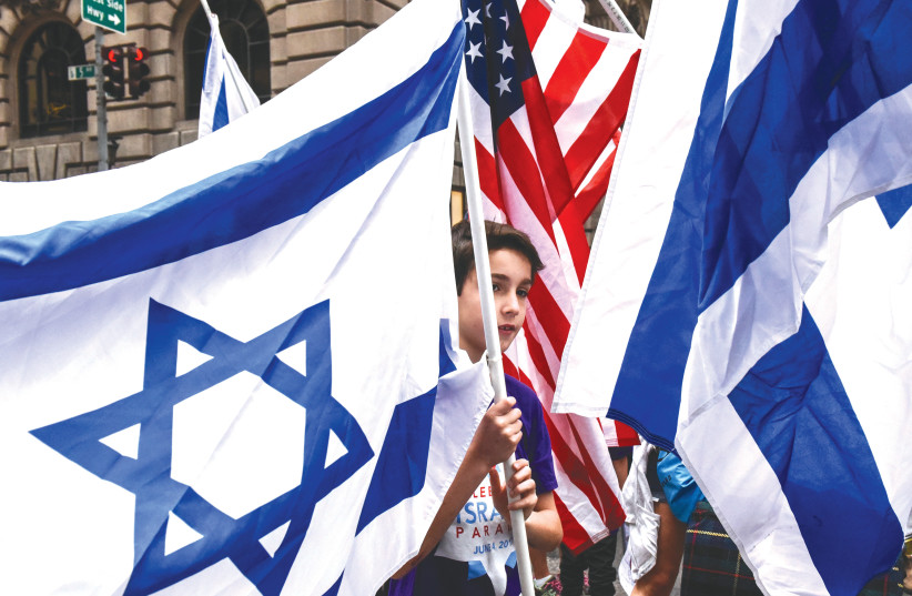  CELEBRATING ISRAEL during a New York parade. What does Chabad have against the flag? (photo credit: STEPHANIE KEITH/REUTERS)
