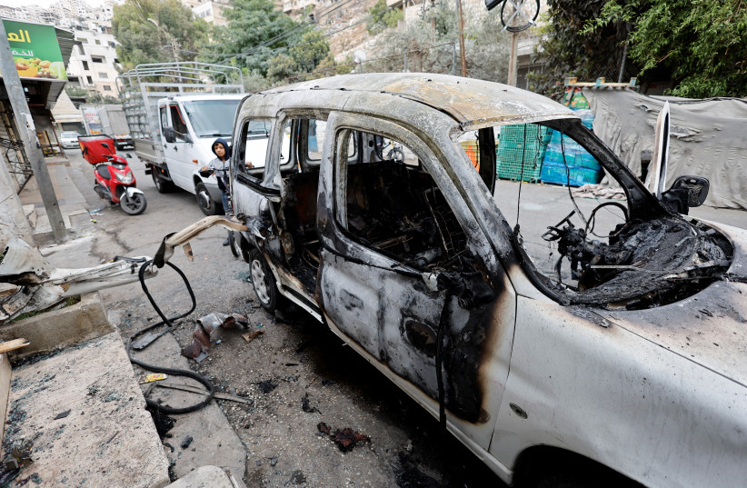  A view shows the remains of a vehicle damaged during an Israeli raid following clashes with Palestinian gunmen, in Nablus on October 25, 2022.  (credit: REUTERS/RANEEN SAWAFTA)