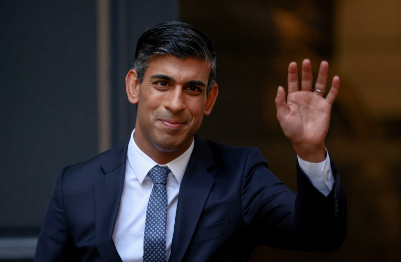  New leader of Britain's Conservative Party Rishi Sunak waves outside the party's headquarters in London, Britain, October 24, 2022. (photo credit: REUTERS/HENRY NICHOLLS)