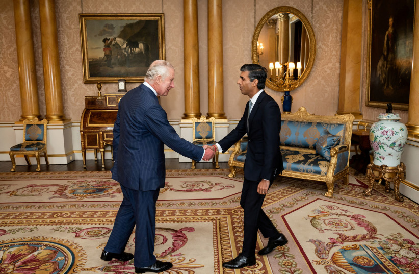 King Charles III welcomes Rishi Sunak during an audience at Buckingham Palace, London, where he invited the newly elected leader of the Conservative Party to become Prime Minister and form a new government. (photo credit: Aaron Chown/PA Wire Aaron Chown/Pool via REUTERS)